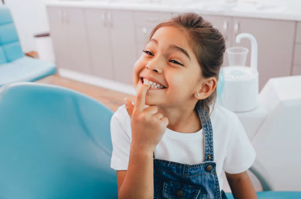 Child smiling at a pediatric dental visit
