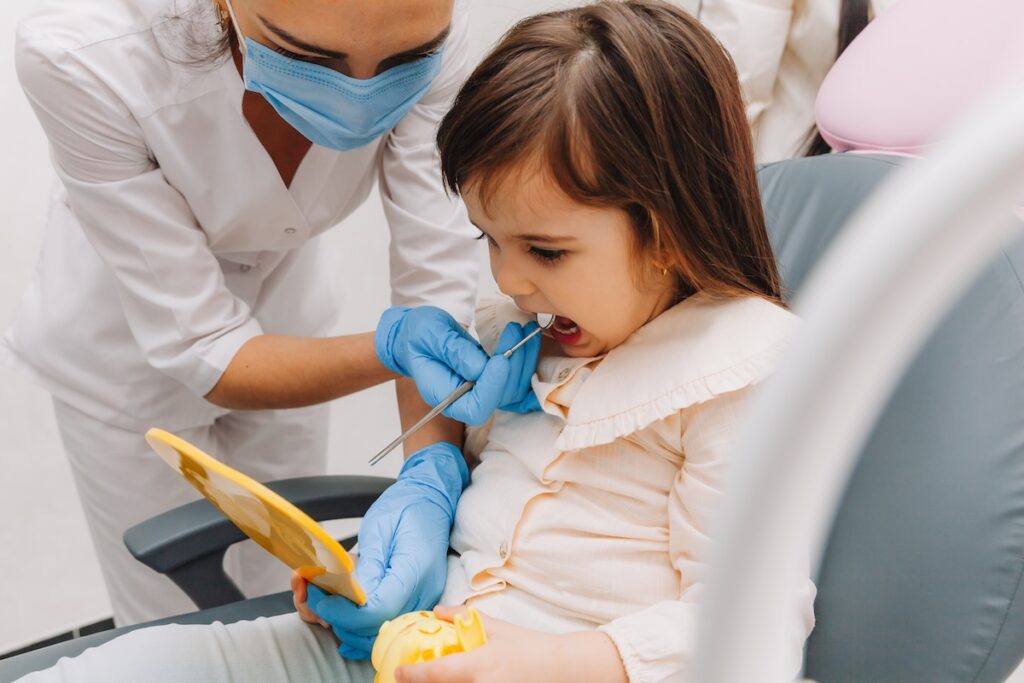 Child smiling during a pediatric dental visit